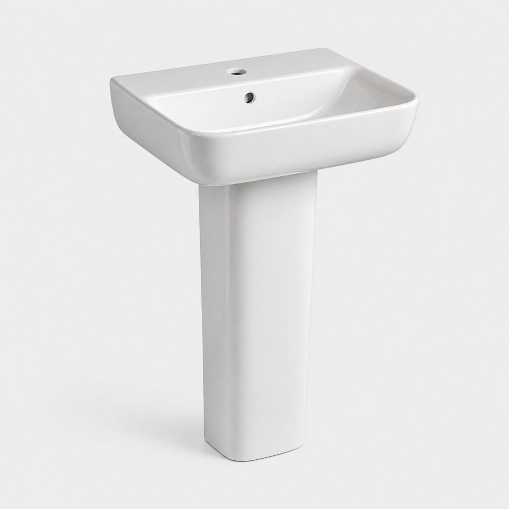 Lavabo sur pied blanc, vue de trois-quarts sur fond clair